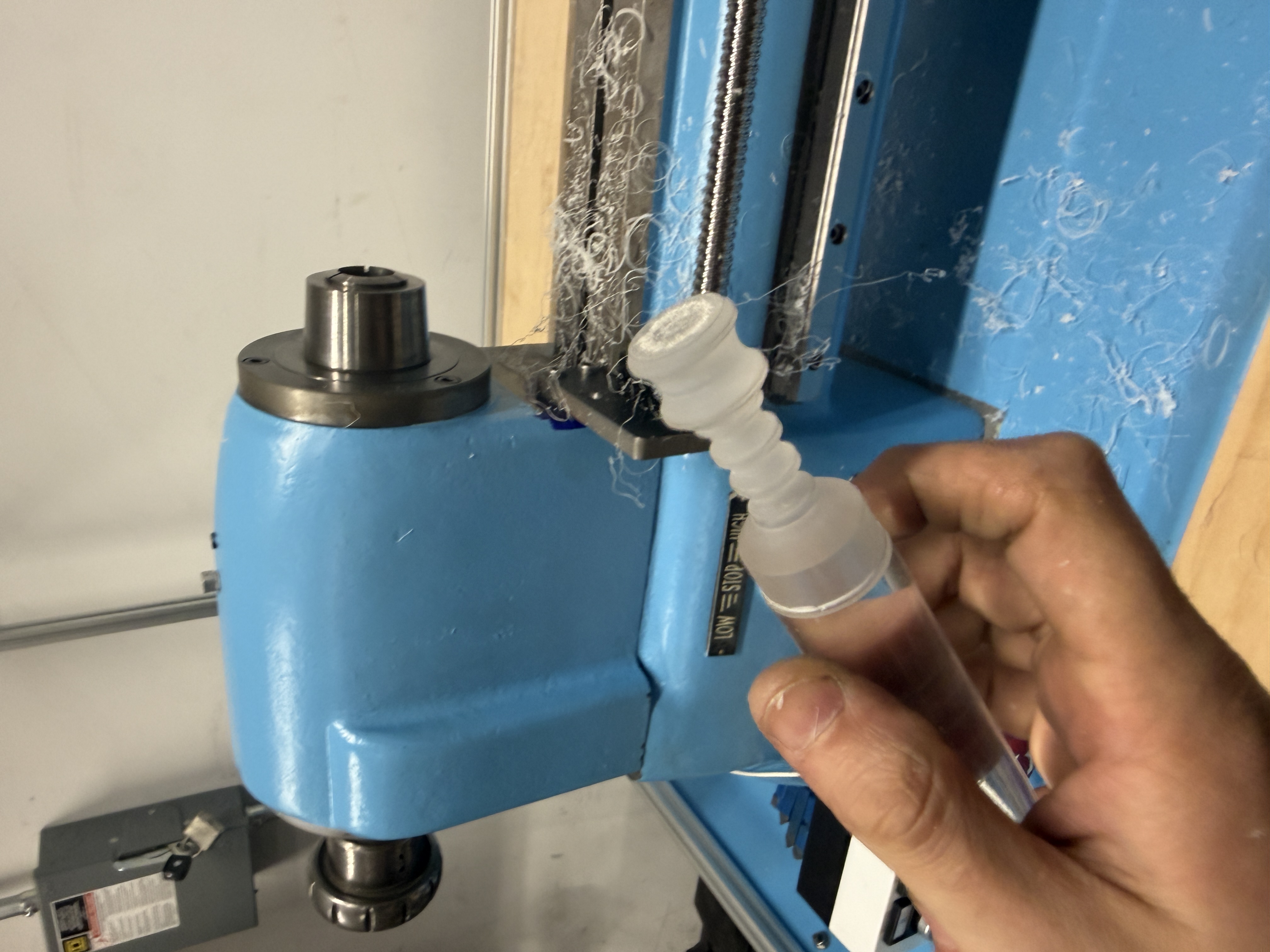 First machined part held up to the spindle